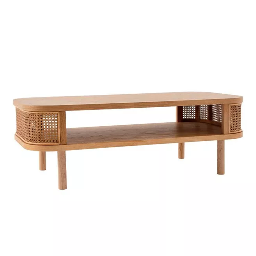 Rattan and Wood Oval Coffee Table in a living room setting