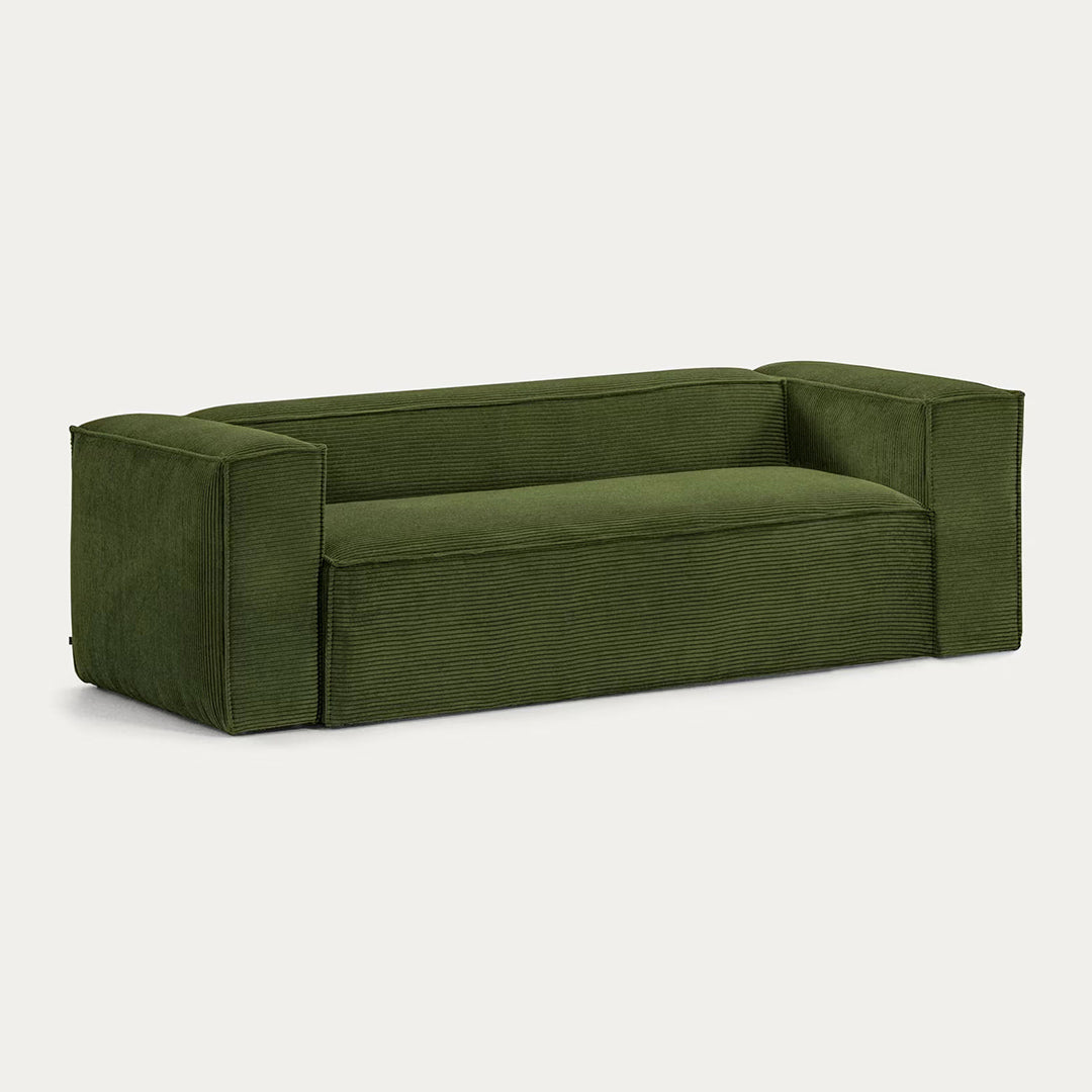 Close up of green corduroy fabric texture on deep seating sofa