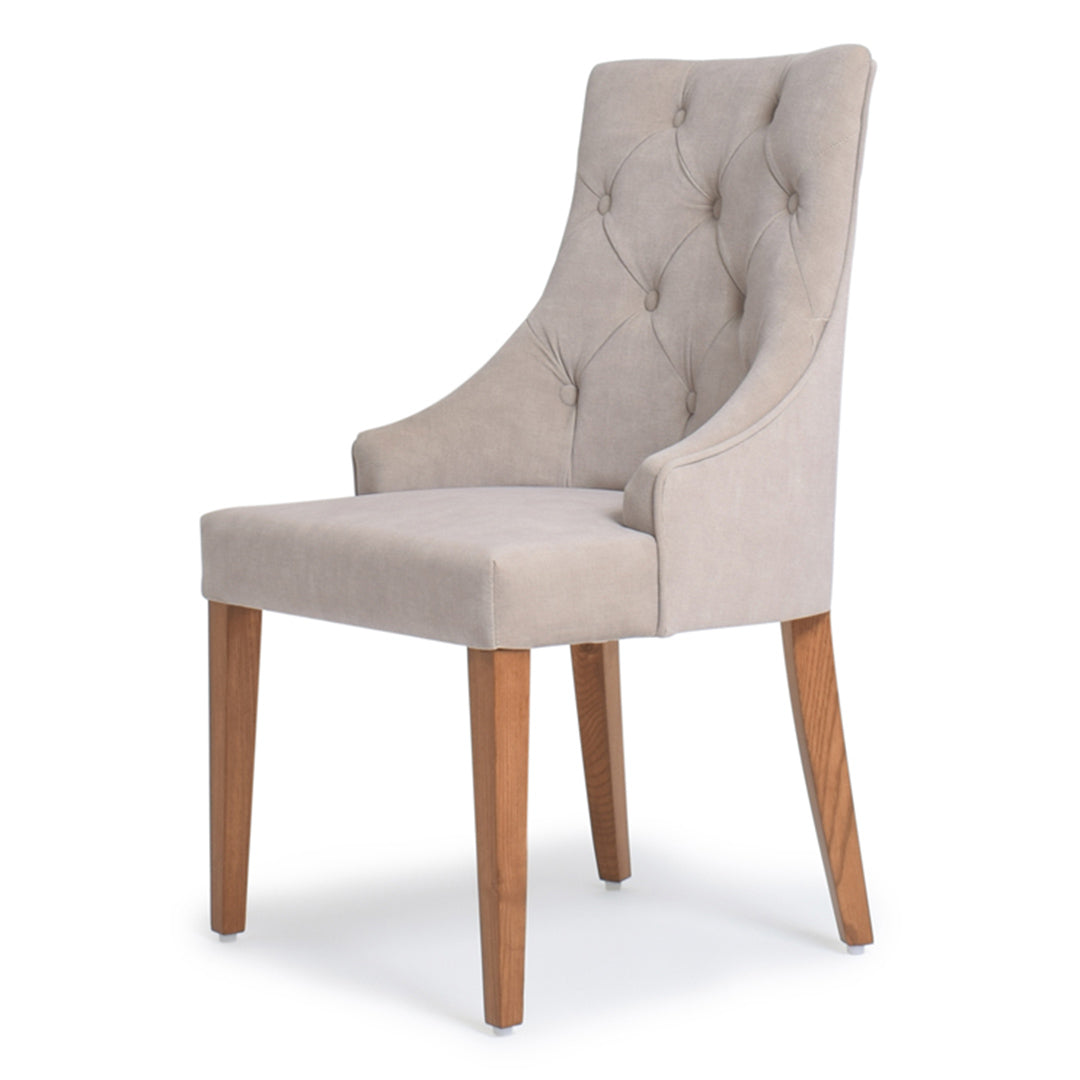 Close up of button tufting on The Clara Dining Chair