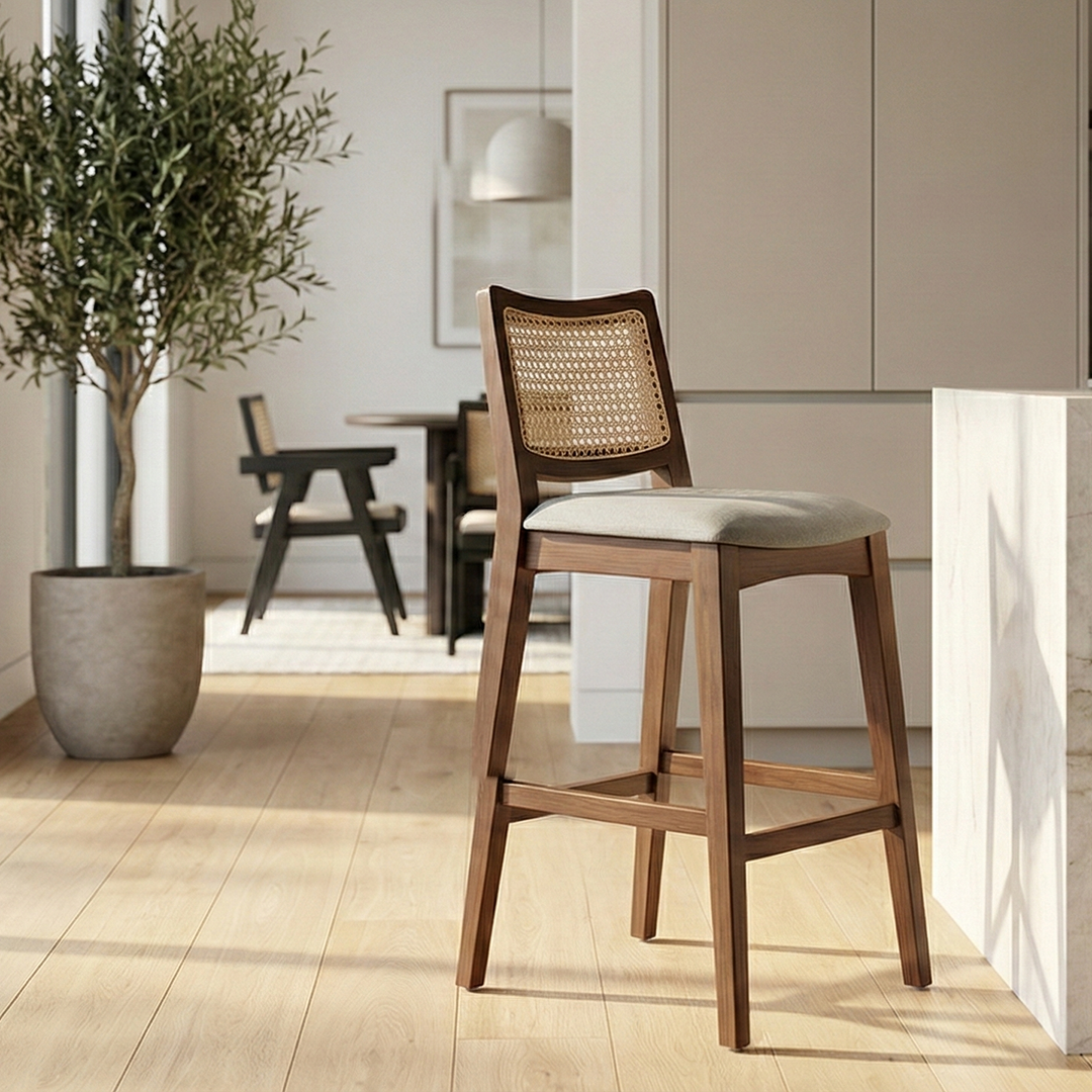 The Riviera Cane Bar Stool placed at a kitchen counter