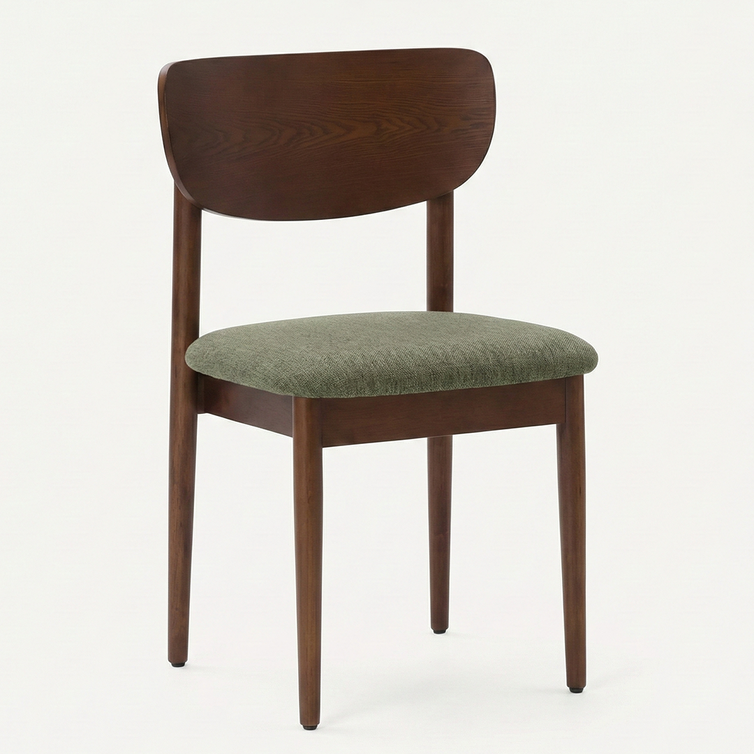 The Grove Mid-Century Dining Chair at a dining table